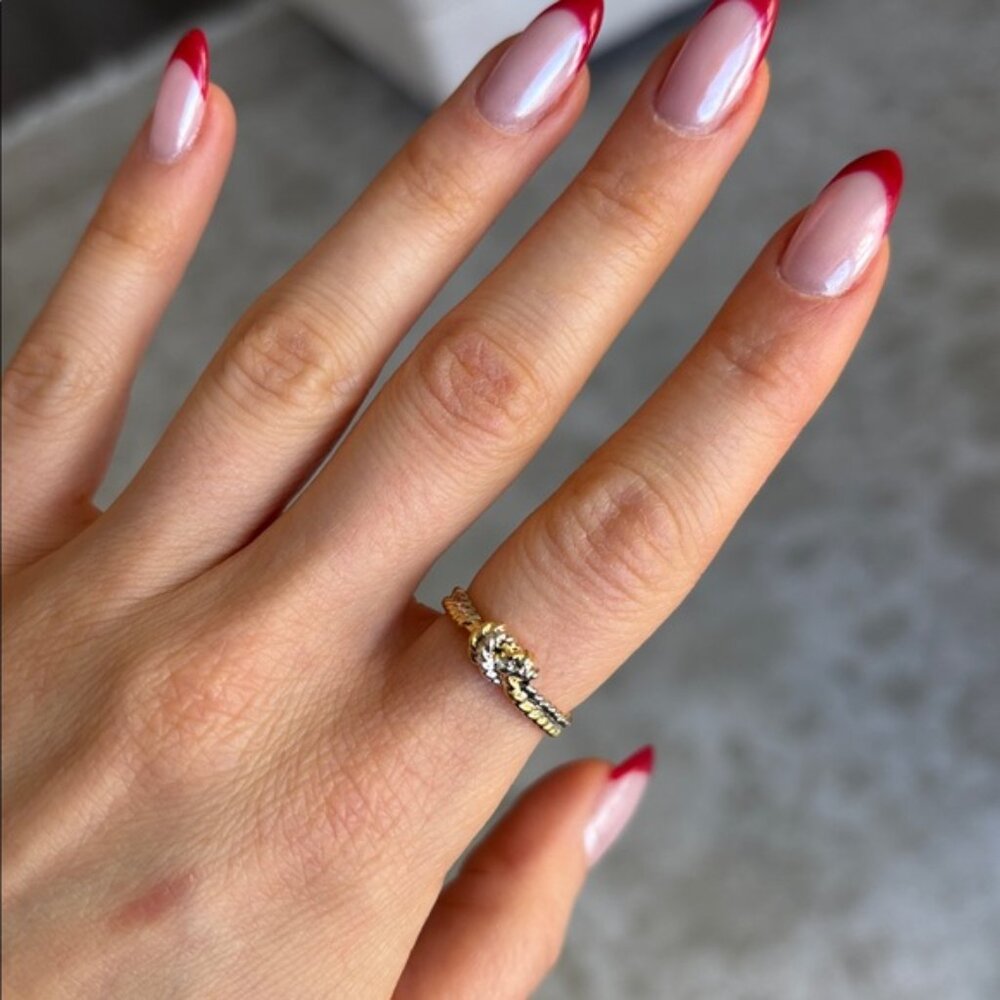 The Robin gold and silver twist dainty love knot ring two tone